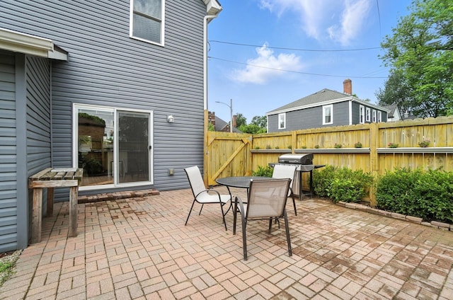 192 E Morrill Ave, Columbus, OH 43207 - view of patio featuring a gate, outdoor dining space, and grilling area