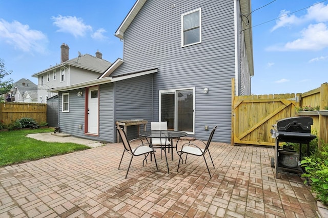 192 E Morrill Ave, Columbus, OH 43207 - rear view of property with a patio, outdoor dining space, and a gate