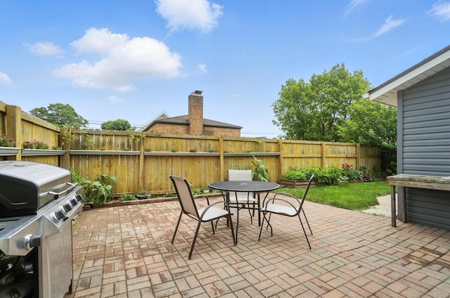 192 E Morrill Ave, Columbus, OH 43207 - fenced backyard with a patio and outdoor dining area