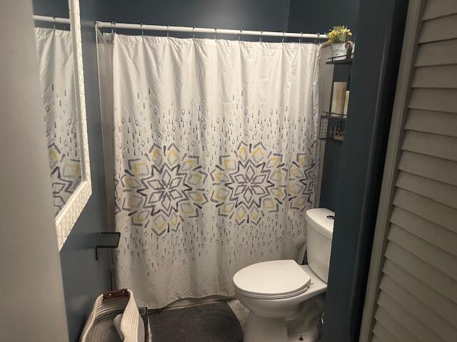 3519 Ontario St, Columbus, OH 43224 - bathroom with toilet and a shower with shower curtain