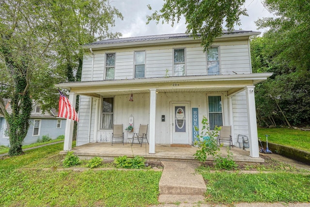 206 W Water St, New Lexington, OH 43764 - view of front of home featuring covered porch