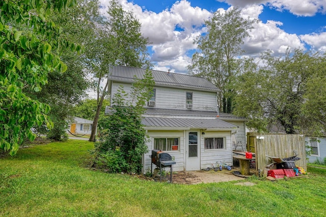 206 W Water St, New Lexington, OH 43764 - back of house featuring a metal roof and a lawn