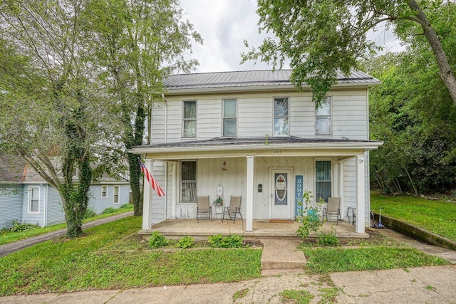 206 W Water St, New Lexington, OH 43764 - view of front of home featuring covered porch and a metal roof