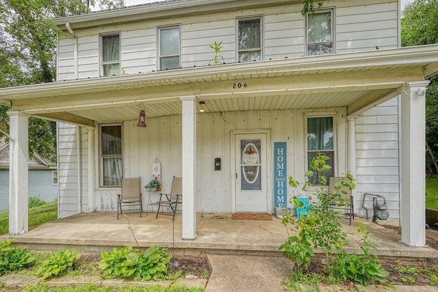 206 W Water St, New Lexington, OH 43764 - view of exterior entry with covered porch
