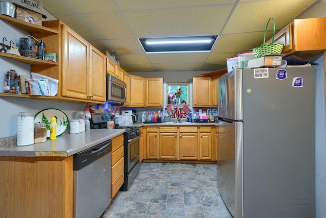 206 W Water St, New Lexington, OH 43764 - kitchen featuring appliances with stainless steel finishes, a paneled ceiling, stone finish floors, and open shelves