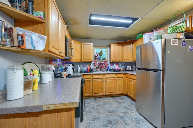 206 W Water St, New Lexington, OH 43764 - kitchen with appliances with stainless steel finishes, a drop ceiling, open shelves, and stone finish floors