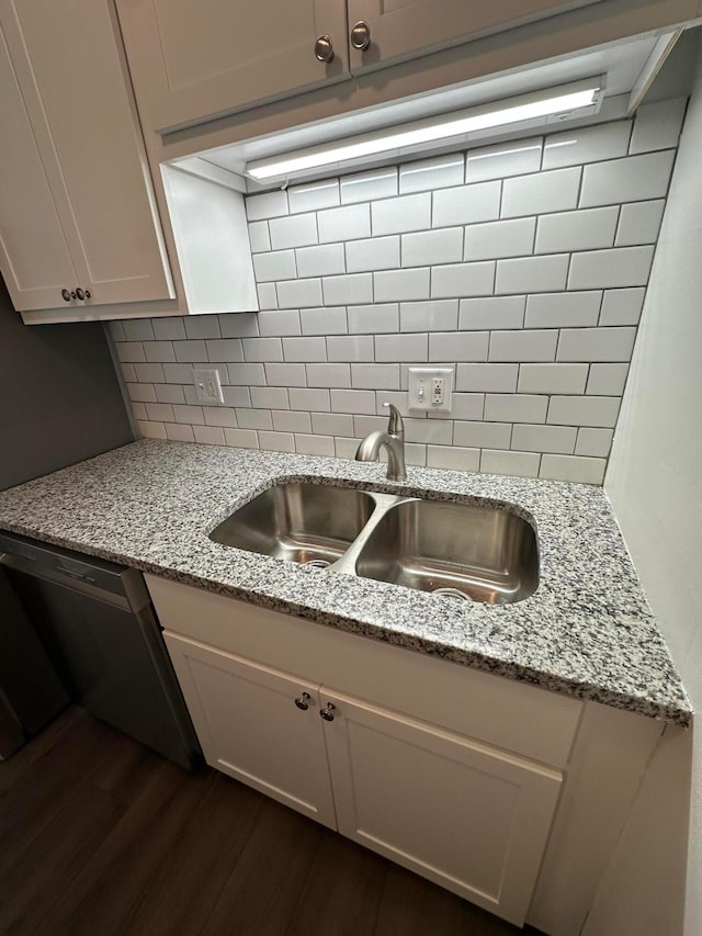 2544 Home Acre Dr Unit 40, Columbus, OH 43231 - kitchen featuring dishwashing machine, dark wood-type flooring, decorative backsplash, and light stone counters