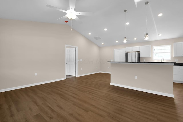 763 Whitetail Loop, Newark, OH 43055 - unfurnished living room featuring dark wood-type flooring, ceiling fan, lofted ceiling, and recessed lighting