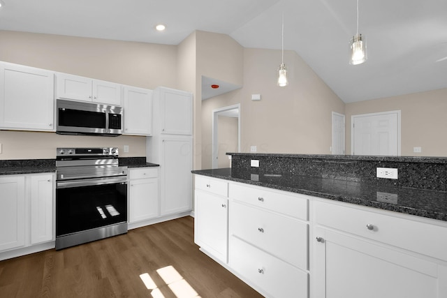 763 Whitetail Loop, Newark, OH 43055 - kitchen featuring appliances with stainless steel finishes, white cabinetry, dark wood finished floors, dark stone countertops, and high vaulted ceiling