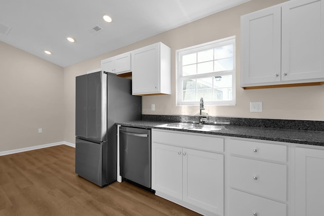 763 Whitetail Loop, Newark, OH 43055 - kitchen featuring appliances with stainless steel finishes, wood finished floors, white cabinets, and recessed lighting