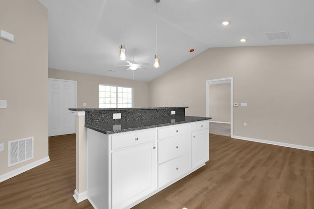763 Whitetail Loop, Newark, OH 43055 - kitchen with wood finished floors, a center island, ceiling fan, white cabinets, and vaulted ceiling
