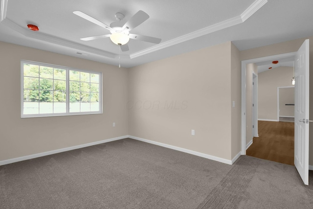763 Whitetail Loop, Newark, OH 43055 - carpeted empty room featuring a tray ceiling, a ceiling fan, and crown molding