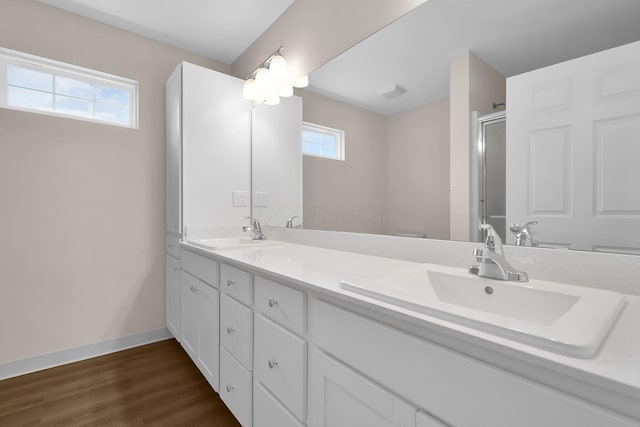 763 Whitetail Loop, Newark, OH 43055 - full bathroom with double vanity, an enclosed shower, and wood finished floors
