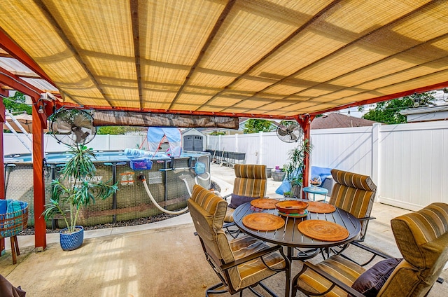 599 S Brinker Ave, Columbus, OH 43204 - fenced backyard with outdoor dining area, a patio area, and a storage unit