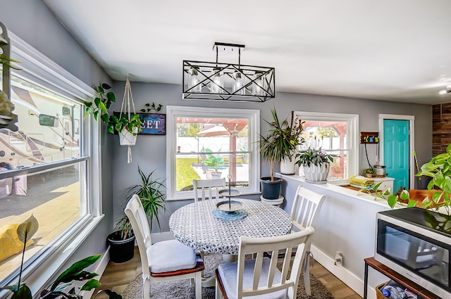 599 S Brinker Ave, Columbus, OH 43204 - dining room featuring wood finished floors and a chandelier
