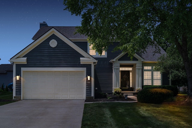 333 Quarter Way, Delaware, OH 43015 - view of front of house with concrete driveway, a chimney, a front lawn, a garage, and a shingled roof
