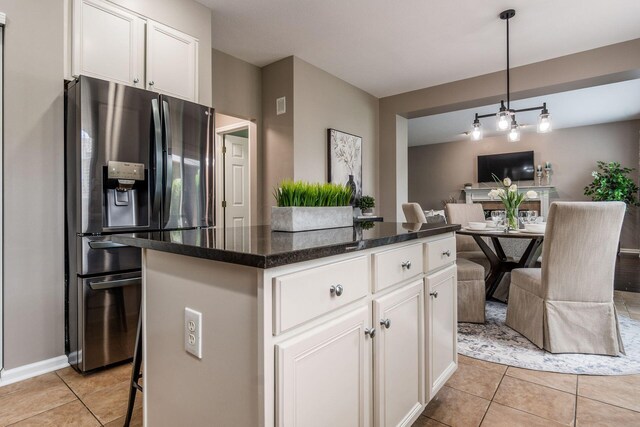 333 Quarter Way, Delaware, OH 43015 - kitchen featuring stainless steel fridge with ice dispenser, light tile patterned flooring, white cabinetry, and a kitchen island
