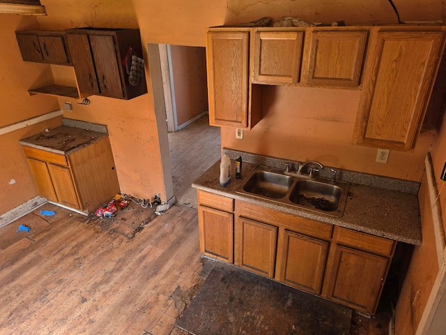 115 David St, Delaware, OH 43015 - kitchen with wood finished floors and brown cabinets