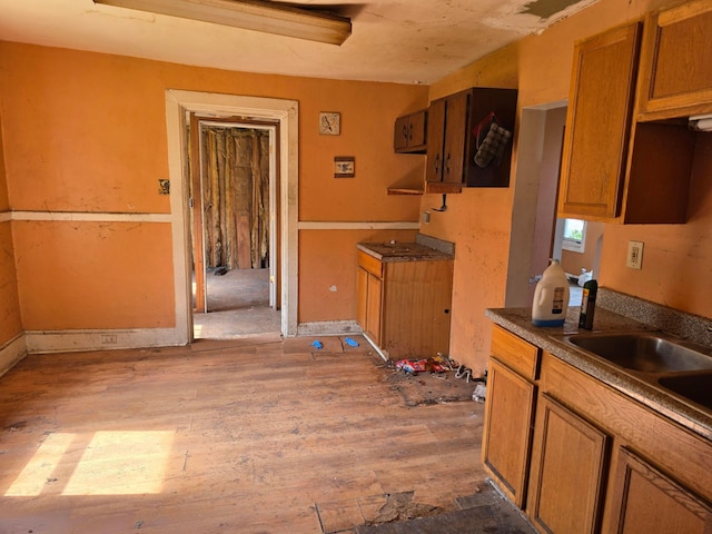 115 David St, Delaware, OH 43015 - kitchen featuring hardwood / wood-style flooring and brown cabinetry