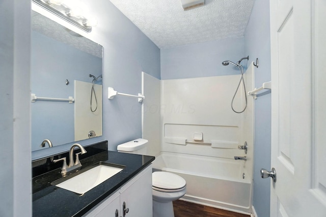1812 Bennigan Dr Unit 88C, Hilliard, OH 43026 - bathroom with bathing tub / shower combination, wood finished floors, vanity, and a textured ceiling