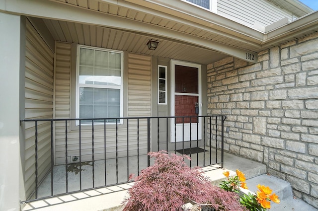 1812 Bennigan Dr Unit 88C, Hilliard, OH 43026 - view of exterior entry featuring stone siding and a porch