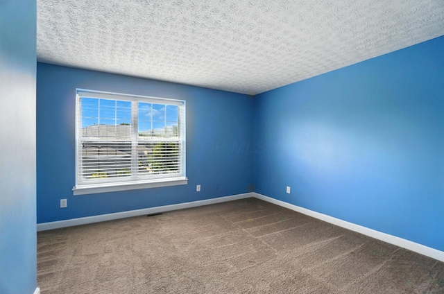 1812 Bennigan Dr Unit 88C, Hilliard, OH 43026 - unfurnished room with a textured ceiling and carpet