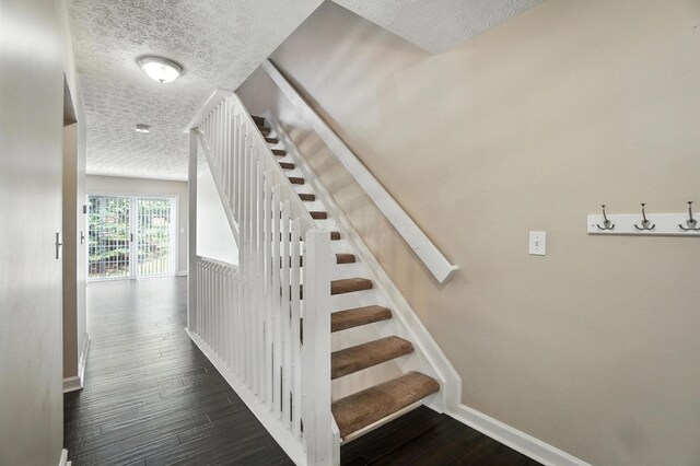 1812 Bennigan Dr Unit 88C, Hilliard, OH 43026 - stairs with a textured ceiling and wood finished floors
