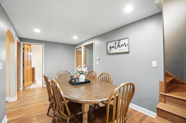 328 Maple Ave, Utica, OH 43080 - dining space with recessed lighting, light wood-style floors, stairs, and arched walkways