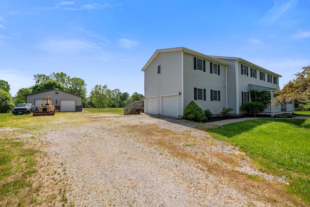 5373 Summit Rd SW, Pataskala, OH 43062 - view of property exterior featuring a detached garage and a yard