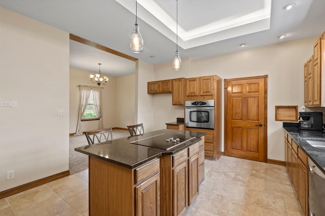 5373 Summit Rd SW, Pataskala, OH 43062 - kitchen with stainless steel appliances, a center island, decorative light fixtures, and dark stone countertops