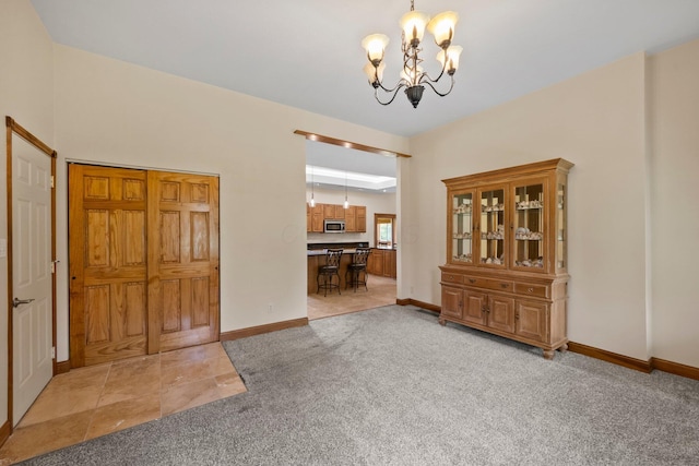 5373 Summit Rd SW, Pataskala, OH 43062 - foyer entrance with light colored carpet and a chandelier