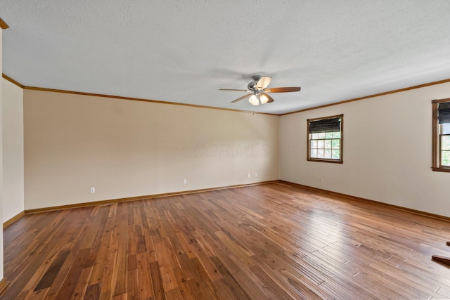 5373 Summit Rd SW, Pataskala, OH 43062 - spare room with crown molding, ceiling fan, wood-type flooring, and a textured ceiling