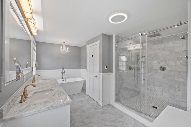 5373 Summit Rd SW, Pataskala, OH 43062 - full bathroom with a stall shower, wainscoting, double vanity, a freestanding tub, and marble look tiles