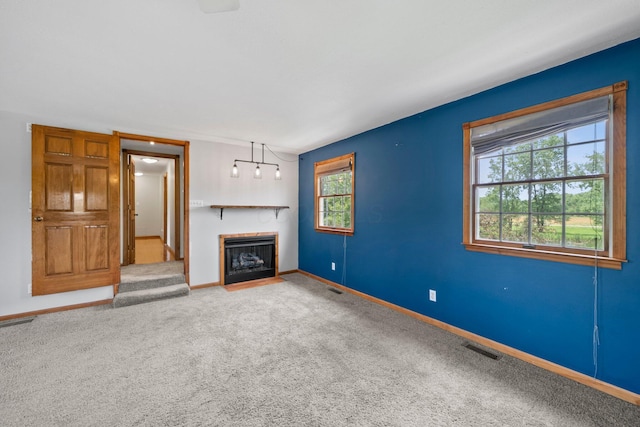 5373 Summit Rd SW, Pataskala, OH 43062 - unfurnished living room featuring a fireplace with flush hearth and carpet floors