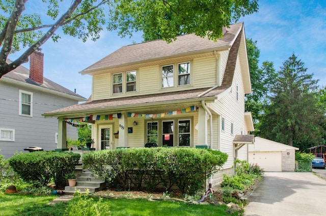 879 College Ave, Columbus, OH 43209 - view of front facade with a porch, an outbuilding, a shingled roof, and a garage