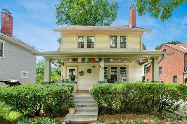879 College Ave, Columbus, OH 43209 - view of front facade with covered porch and a chimney