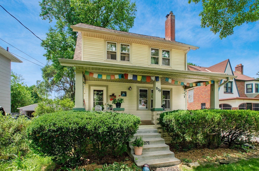 879 College Ave, Columbus, OH 43209 - view of front of home with a porch and a chimney