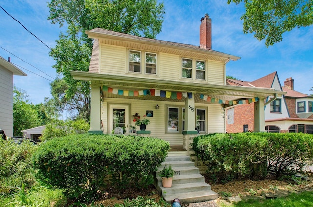 879 College Ave, Columbus, OH 43209 - view of front of home with a porch and a chimney
