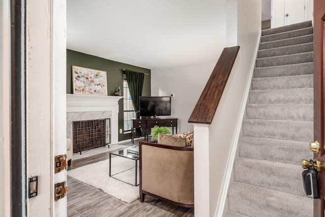 7911 Verandah Ct Unit 58, Powell, OH 43065 - stairway with wood finished floors and a high end fireplace
