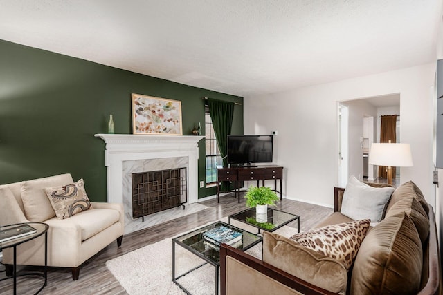 7911 Verandah Ct Unit 58, Powell, OH 43065 - living room with wood finished floors and a high end fireplace