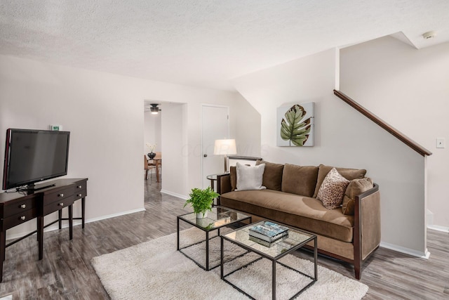 7911 Verandah Ct Unit 58, Powell, OH 43065 - living area featuring wood finished floors and a textured ceiling