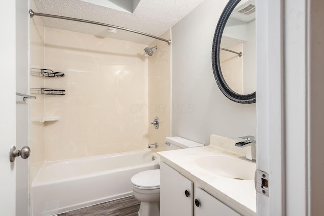 7911 Verandah Ct Unit 58, Powell, OH 43065 - bathroom with wood finished floors, shower / bathtub combination, vanity, and a textured ceiling