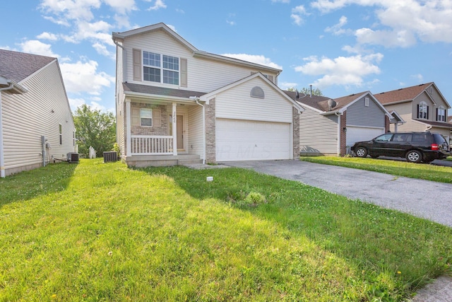 3866 Sugarbark Dr, Canal Winchester, OH 43110 - traditional-style home featuring a front yard, asphalt driveway, a garage, and covered porch