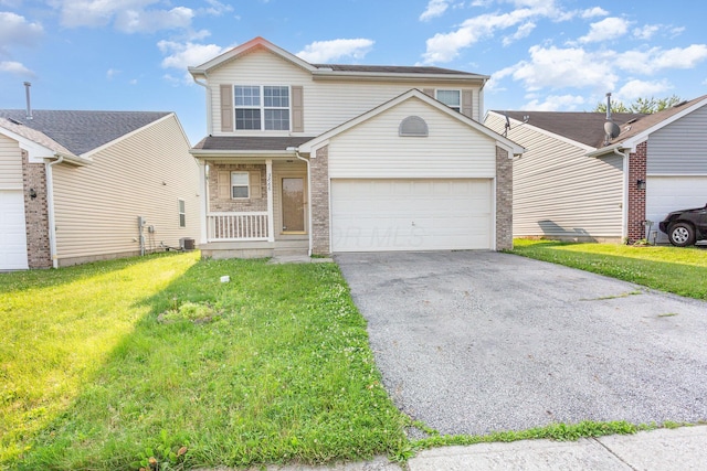 3866 Sugarbark Dr, Canal Winchester, OH 43110 - traditional home featuring driveway, a front yard, a porch, and brick siding