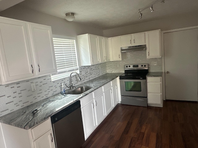 3866 Sugarbark Dr, Canal Winchester, OH 43110 - kitchen featuring stainless steel appliances, under cabinet range hood, white cabinetry, and backsplash