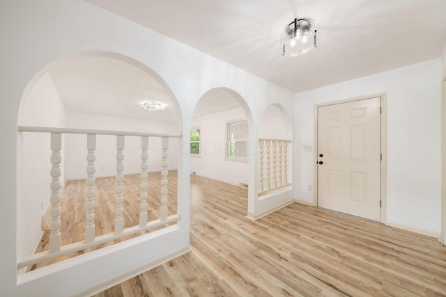 1571 Vinton Ave, Columbus, OH 43220 - entryway with wood finished floors and arched walkways
