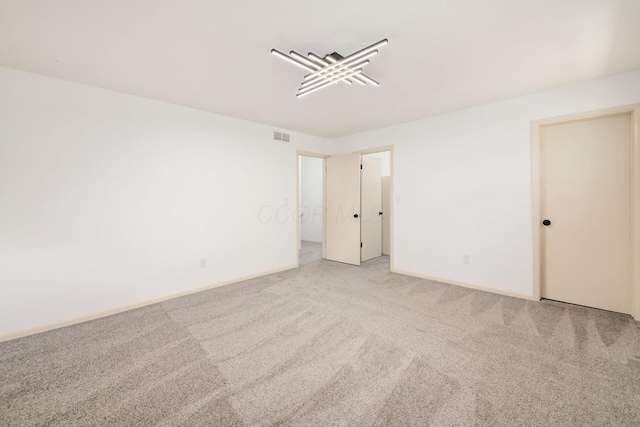 1571 Vinton Ave, Columbus, OH 43220 - spare room with carpet flooring and baseboards