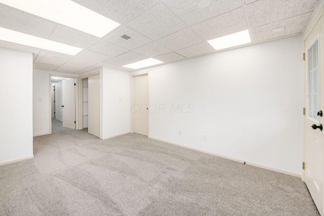 1571 Vinton Ave, Columbus, OH 43220 - carpeted spare room featuring a drop ceiling and baseboards