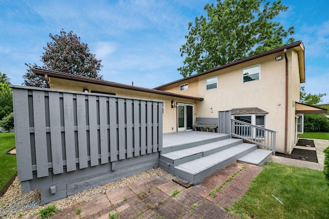 1571 Vinton Ave, Columbus, OH 43220 - back of house featuring a wooden deck and stucco siding