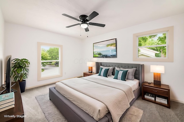 1571 Vinton Ave, Columbus, OH 43220 - carpeted bedroom with multiple windows and a ceiling fan